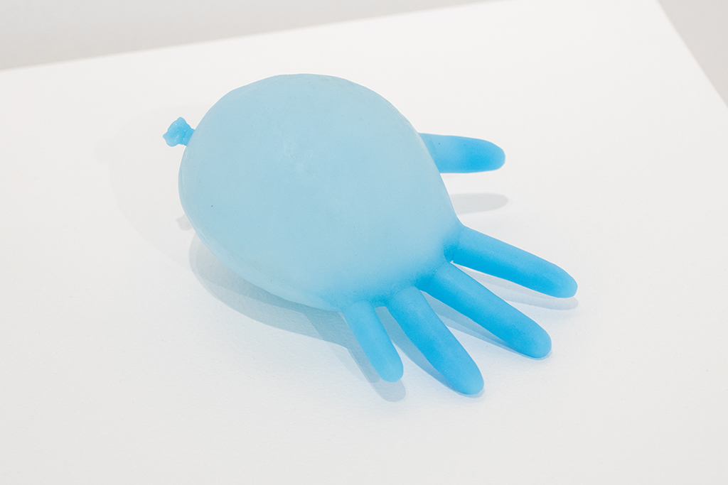 A sculpture that looks like an inflated blue surgical glove