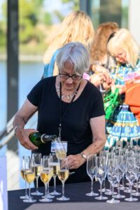 Person pouring wine