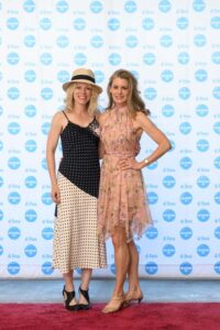 People standing in front of a "di Rosa" backdrop, smiling.