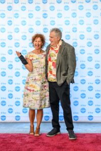 People standing in front of a "di Rosa" backdrop, smiling.