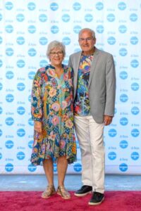 People standing in front of a "di Rosa" backdrop, smiling.